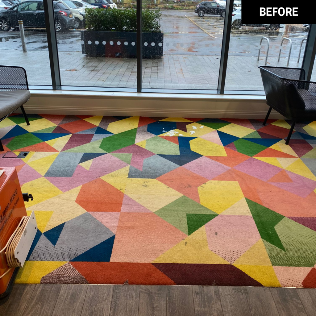 A carpet before a clean by the Trojan FM team