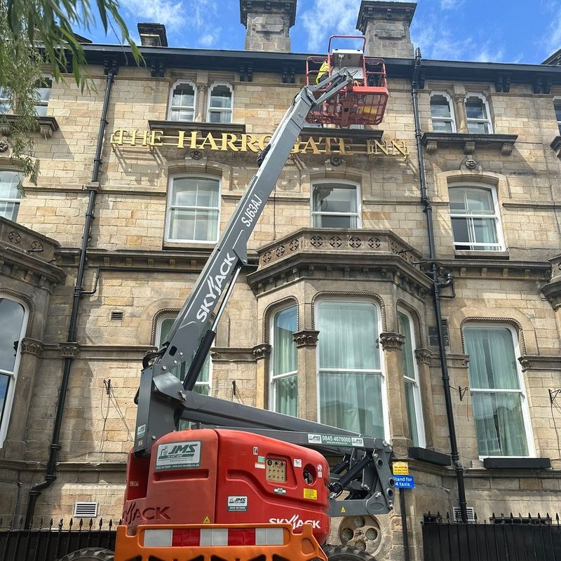 Hotel window being cleaned by a Trojan FM staff member